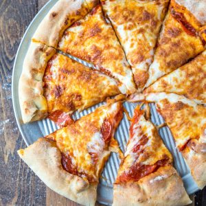 Pepperoni pizza on a silver pizza pan