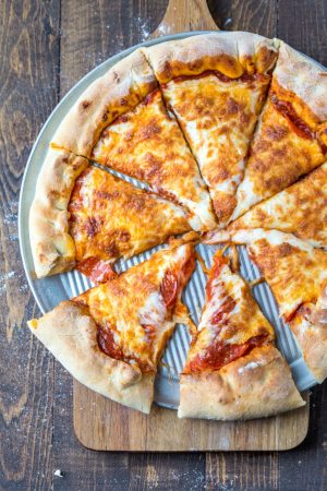 Pepperoni pizza on a silver pizza pan