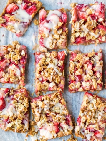 Strawberry Oatmeal Bars on a piece of white parchment paper