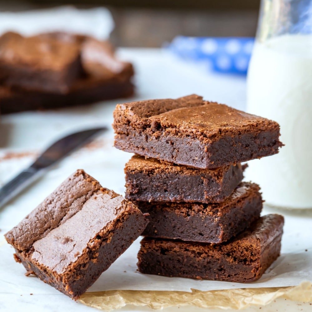 Fudge brownies on light parchment paper