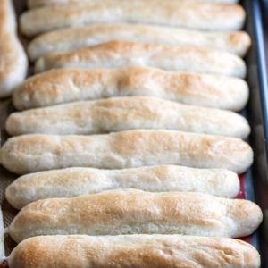 Garlic breadsticks on a metal baking sheet