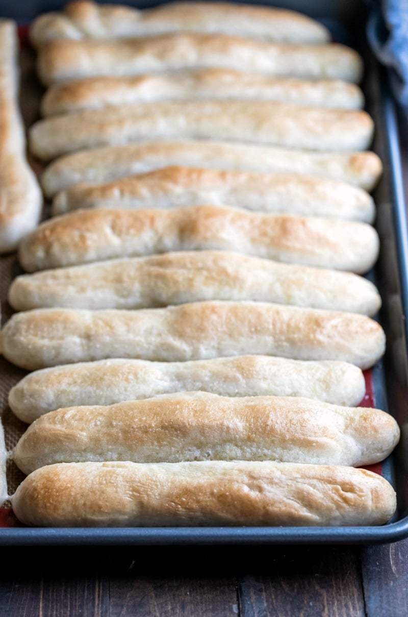 Garlic breadsticks on a metal baking sheet