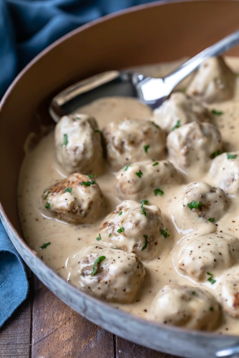 Swedish meatballs in sauce topped with fresh parsley