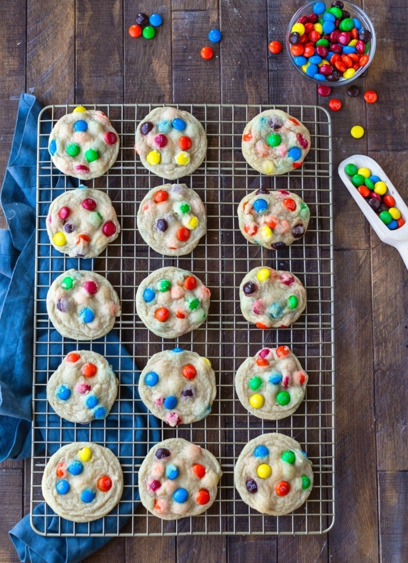 M&M Cookies on a gold wire cooling rack