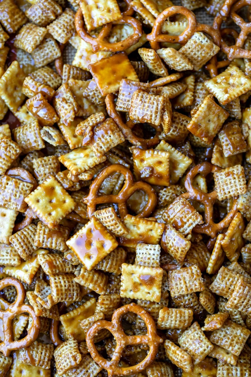 Toffee chex mix in an even layer on a silicone baking mat