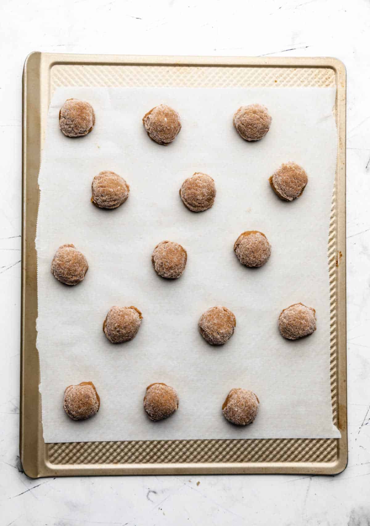 Molasses cookie dough on a baking sheet.