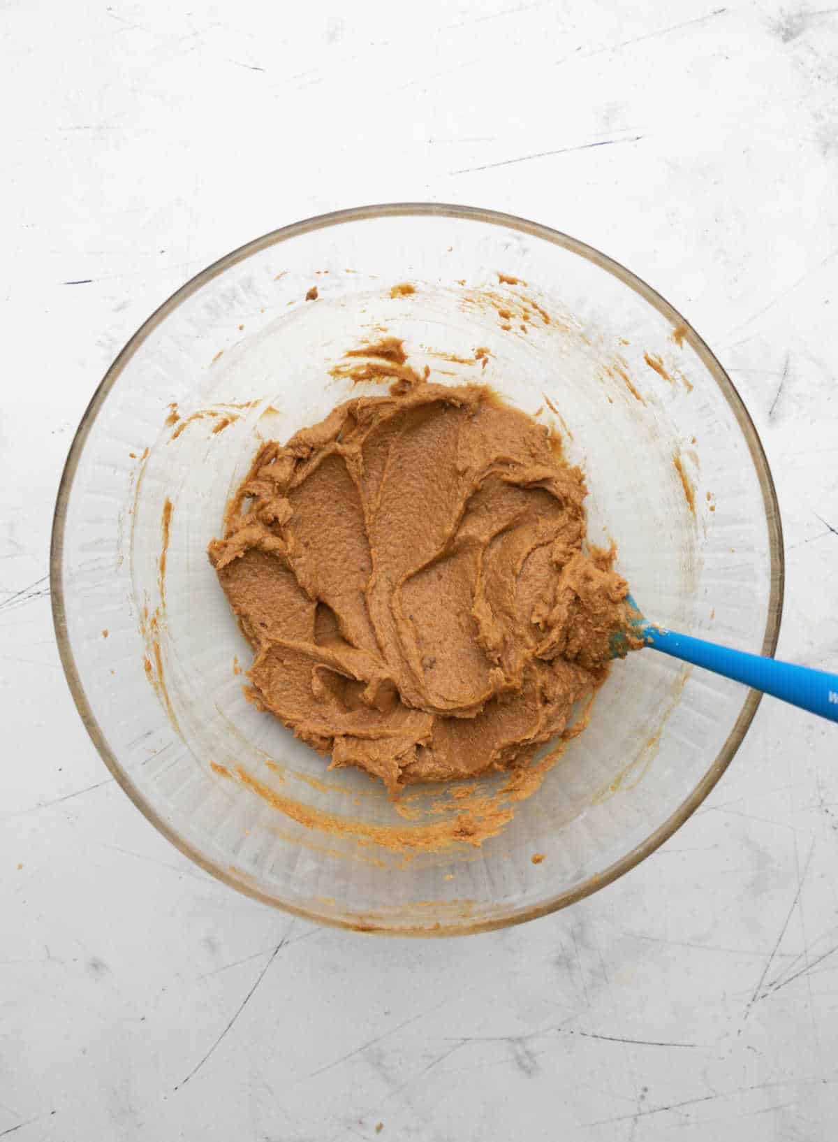 Wet ingredients beaten together in a glass mixing bowl. 