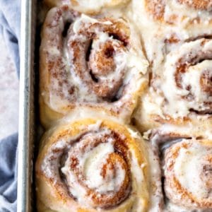 Maple cinnamon rolls in a metal baking pan