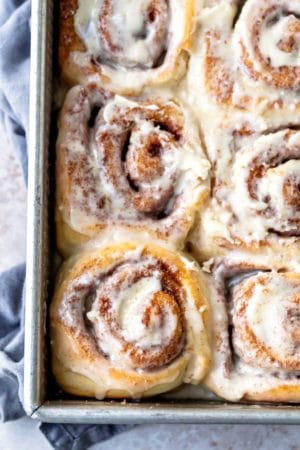 Maple cinnamon rolls in a metal baking pan
