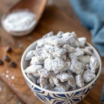 Puppy Chow muddy buddies in a blue and white dish