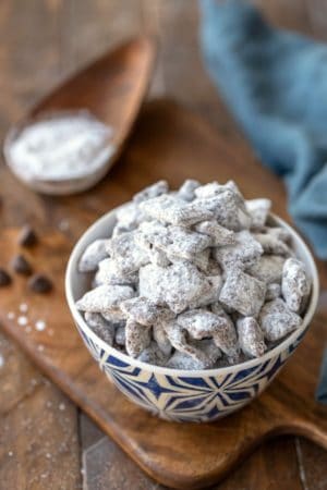 Puppy Chow muddy buddies in a blue and white dish