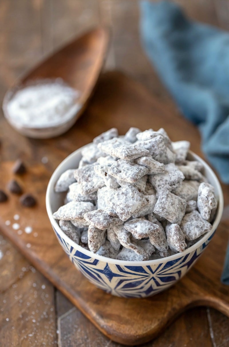 Puppy Chow muddy buddies in a blue and white dish