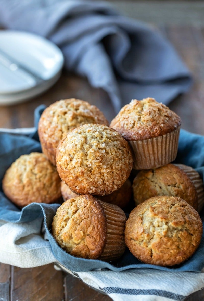 Maple Brown Sugar Oatmeal Muffin Recipe Maple brown sugar oatmeal muffins next to a stack of white plates