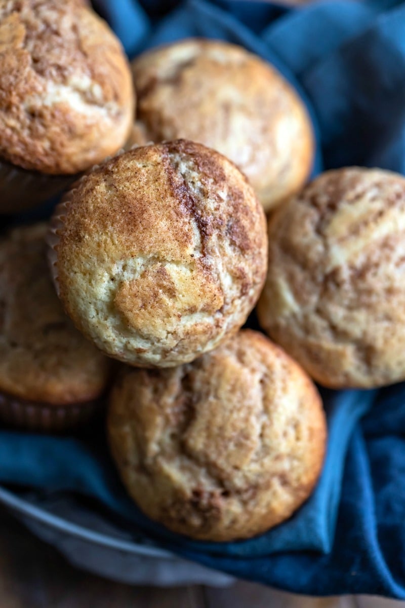 Cinnamon muffins in a linen lined basket
