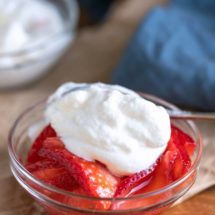 Homemade Whipped Cream on top of strawberries