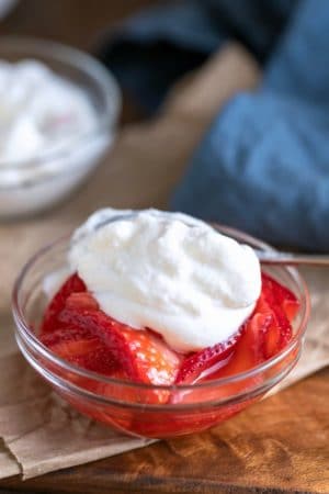 Homemade Whipped Cream on top of strawberries