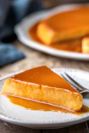 Slice of flan de queso topped with caramel sauce