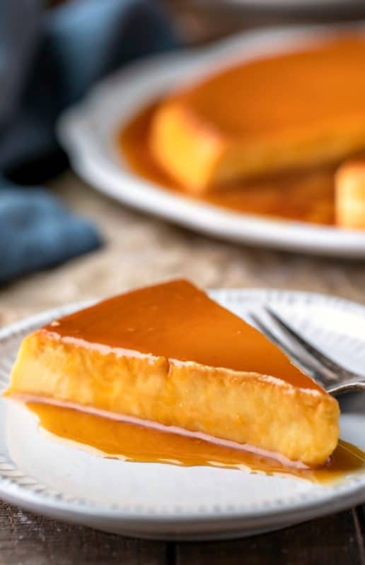 Slice of flan de queso topped with caramel sauce