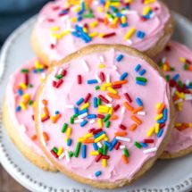 Pink frosted Lofthouse cookie copycats on a cream plate