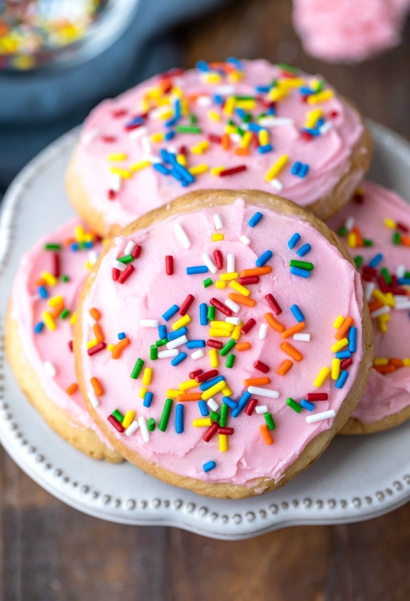 Pink frosted Lofthouse cookie copycats on a cream plate