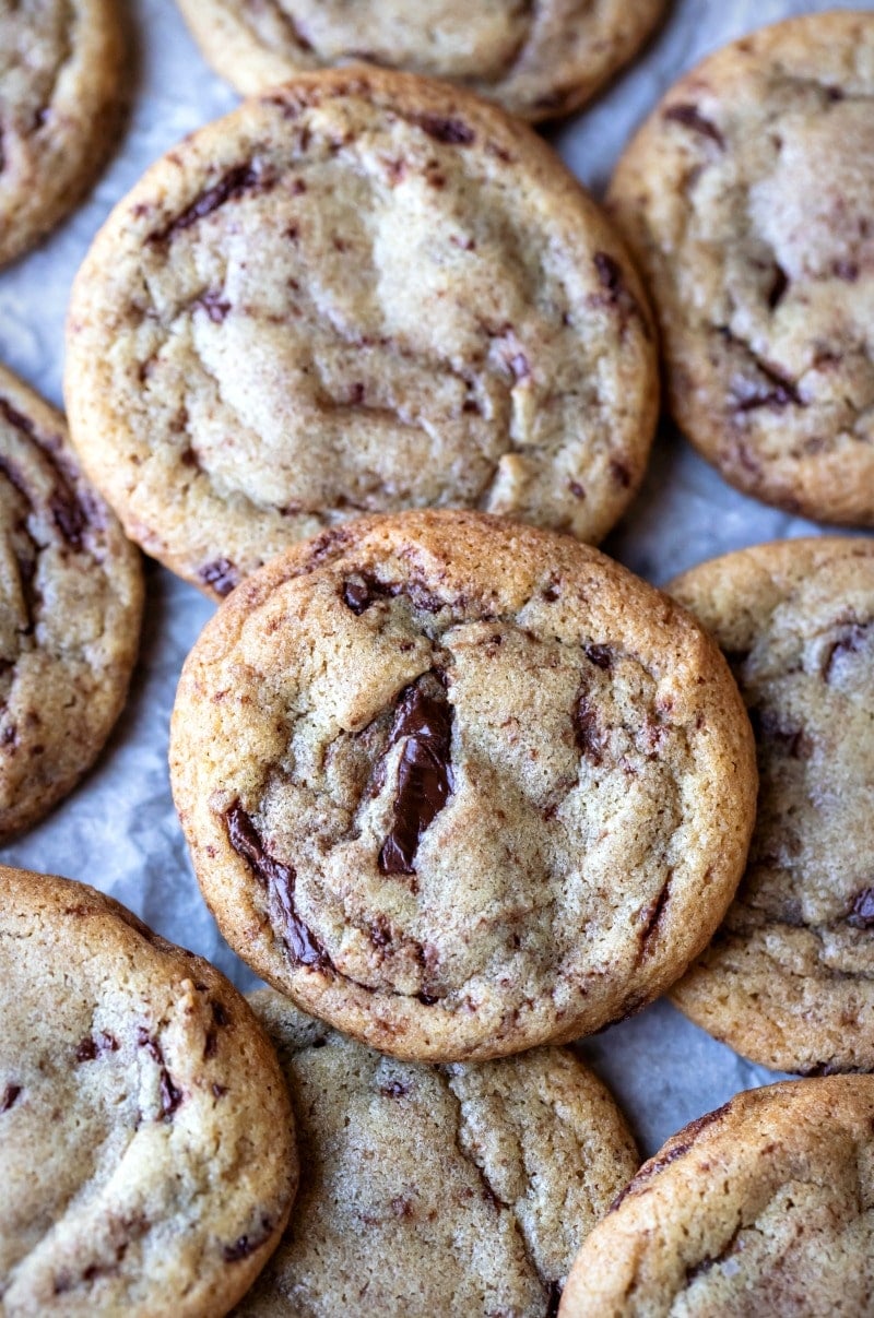 Mexican chocolate chip cookies on a sheet of parchment paper