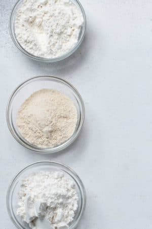 Three glass dishes with flour