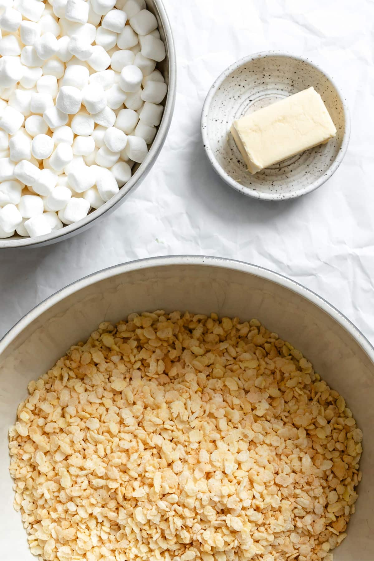 Ingredients for rice krispie treats in dishes.