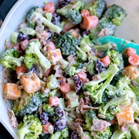 Broccoli Salad in a white mixing bowl.