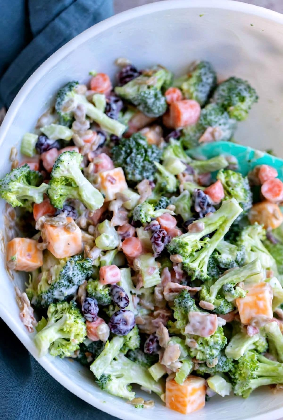 Broccoli Salad in a white mixing bowl.