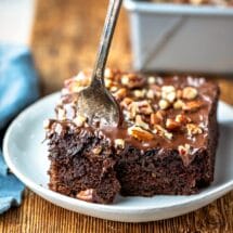 Silver fork taking a bite of chocolate zucchini cake