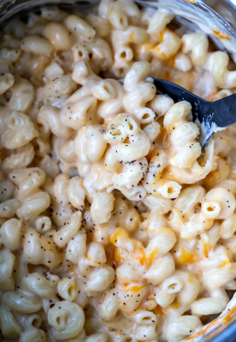 Instant Pot Mac and Cheese Recipe Black spoon in a pot of Instant Pot Mac and Cheese