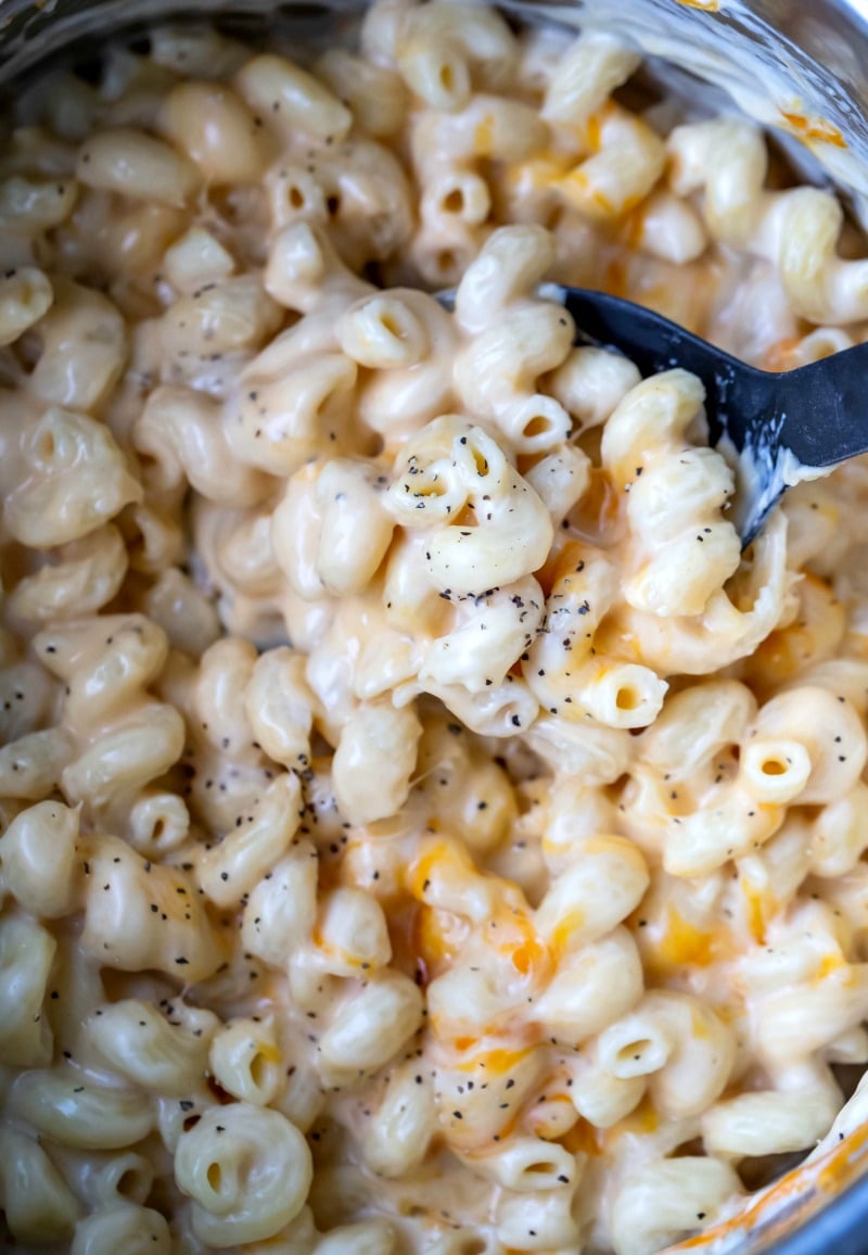 Black spoon in a pot of Instant Pot Mac and Cheese