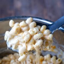 Spoon lifting up a scoop of Instant Pot Mac and Cheese