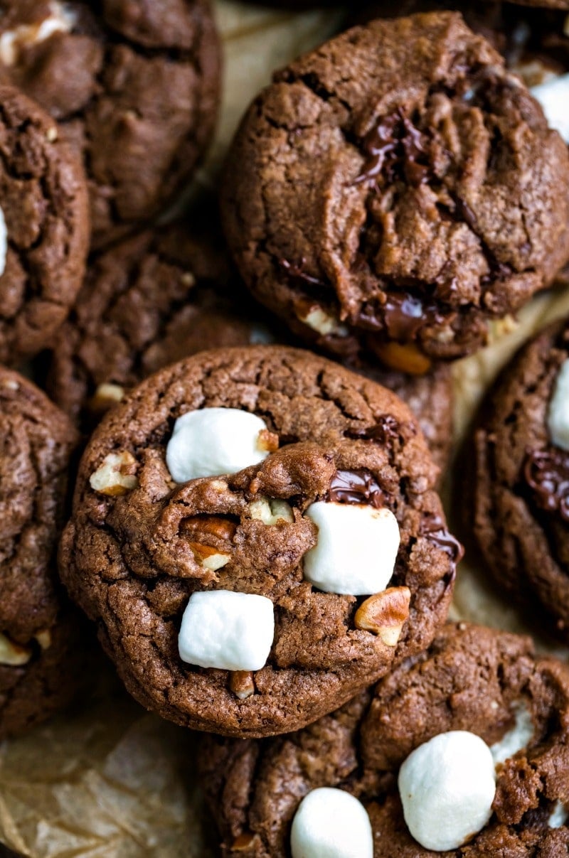 Overlapping Mississippi Mud cookies on a piece of brown parchment paper