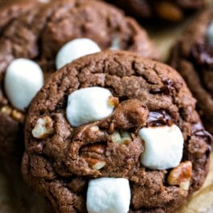 Vertical stack of Mississippi mud cookies on brown parchment paper