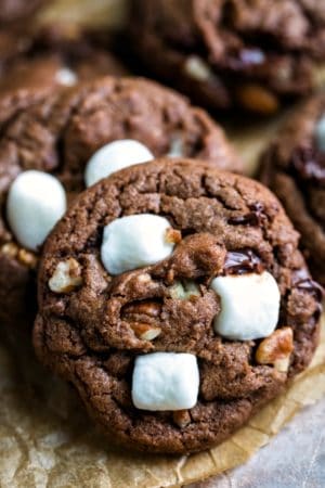 Vertical stack of Mississippi mud cookies on brown parchment paper