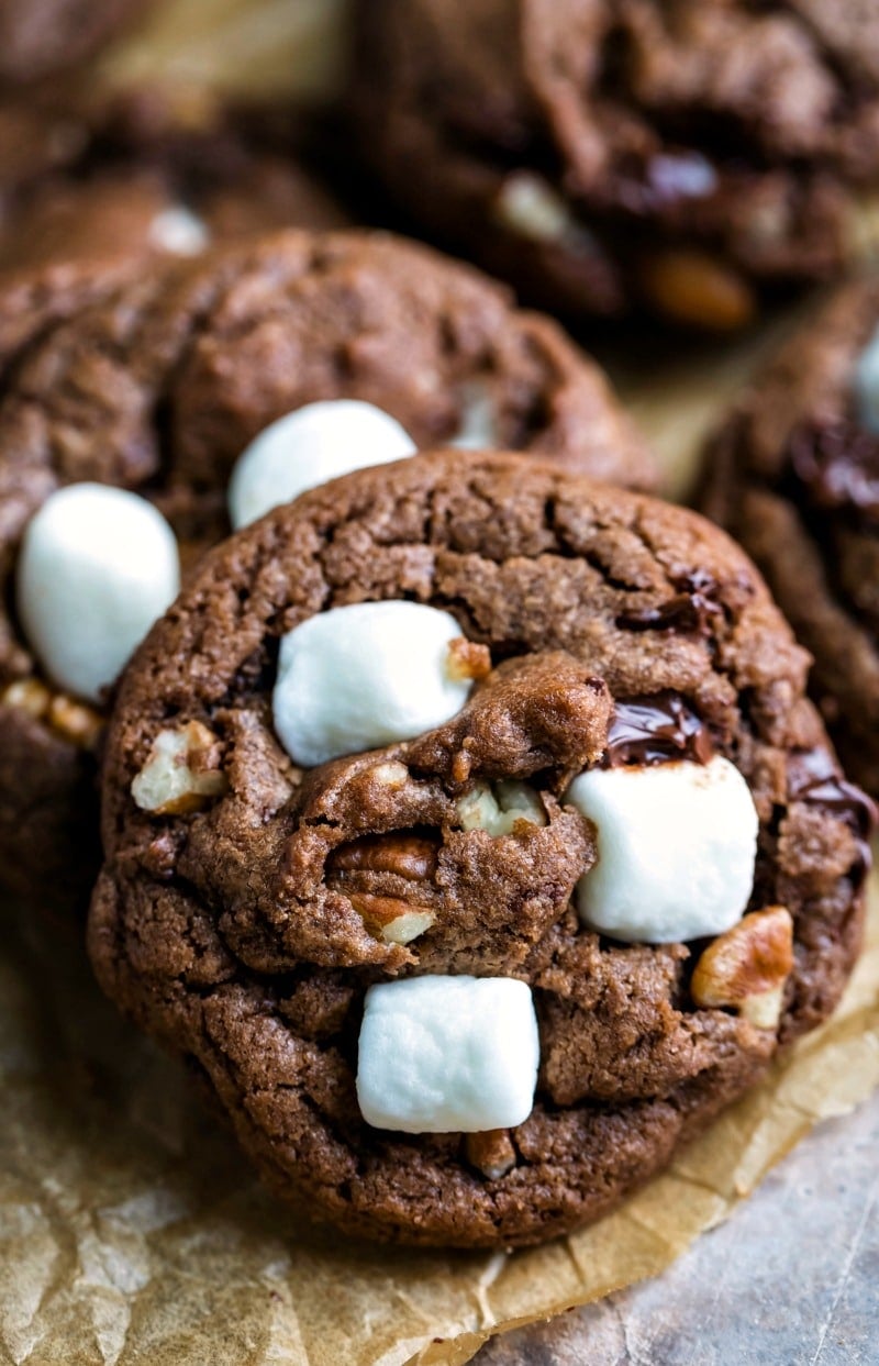 Vertical stack of Mississippi mud cookies on brown parchment paper