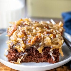 Piece of German chocolate sheet cake on a white plate