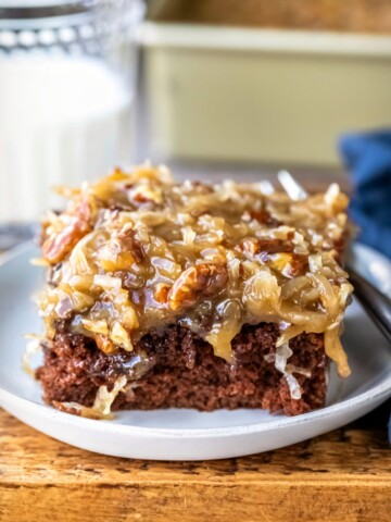 Piece of German chocolate sheet cake on a white plate