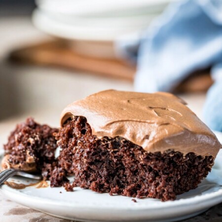 A slice of 6 minute chocolate cake on a white plate.