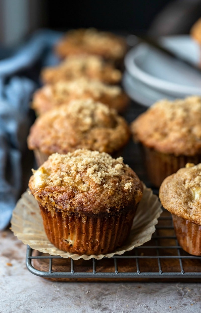 Apple muffins next to a blue linen napkin