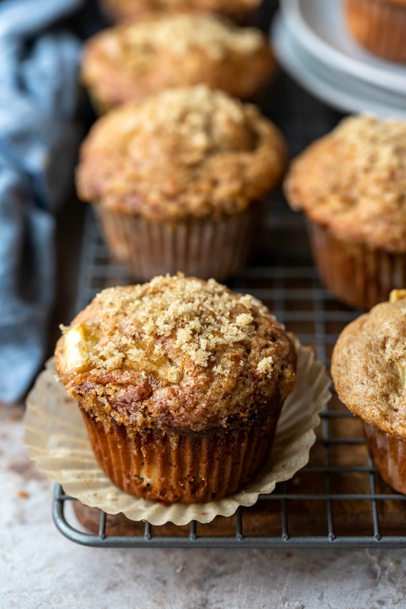 Apple muffin with a parchment paper muffin liner around it