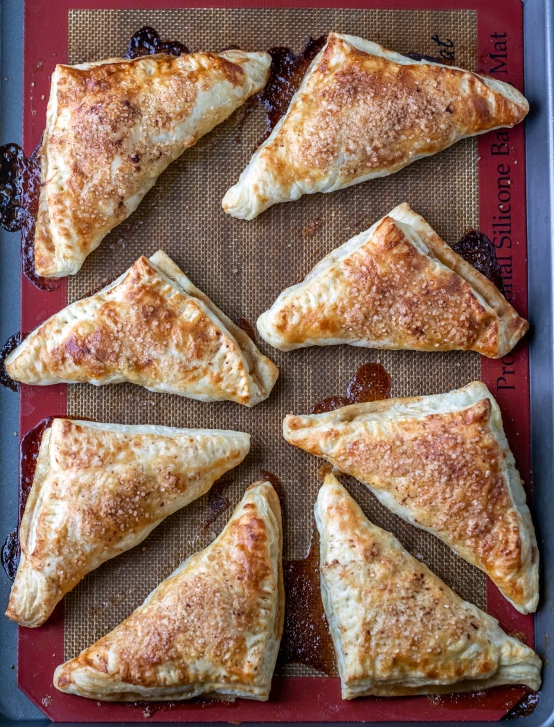 Baked apple turnovers on a baking sheet