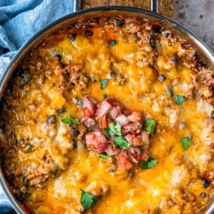 Taco casserole in a stainless steel skillet