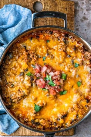 Taco casserole in a stainless steel skillet