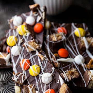 Pieces of Halloween candy bark on a vintage cookie sheet.