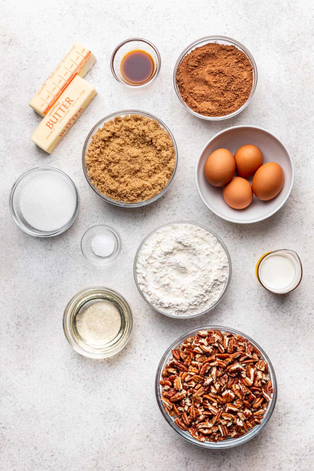 Ingredients for pecan pie brownies in dishes.