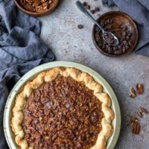 Chocolate Pecan Pie in a gold pie pan