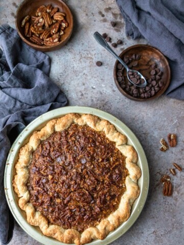 Chocolate Pecan Pie in a gold pie pan