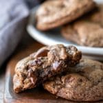 Half of a chocolate mint cookie on a full cookie